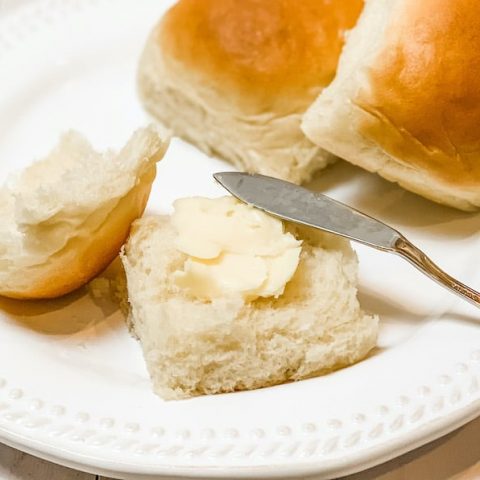 soft and fluffy dinner rolls with butter on top